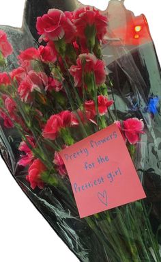 a bunch of flowers with a note attached to it that says pretty flowers for the prettiest girl