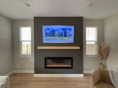 a living room with a fireplace and two couches