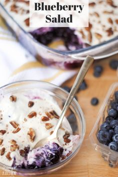 blueberry salad with yogurt and nuts in a glass bowl