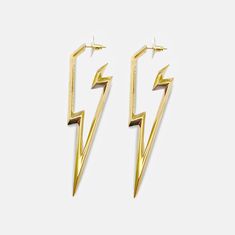 Powerfully electric. This thrilling statement earring will make you the brightest in the room. Each line of the lightning bolt is artfully extruded to perfection, surely to be your new favorite piece. Made of hypoallergenic stainless steel available in a silver or gold finish. Engineered with designer and skin safe sensibility. Ships in RARE-ROMANCE ™ branded packaging, perfect for gifts. Select your style | select your color | Add to cart | Ships same day of purchase PRODUCT SPECIFICATIONSLENTH Lightning Bolt Jewelry, Thunder Bolt, Cross Earring, Butterfly Fashion, Lightning Bolt Earrings, Earring Hoop, Greek Gods And Goddesses, Silver Statement Earrings, Gold Statement Earrings