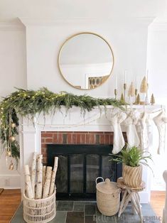 a living room filled with furniture and a fire place covered in greenery next to a fireplace