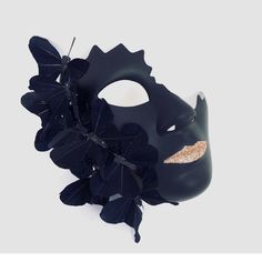 Step into a world of intrigue and allure with our enchanting women's black masquerade mask featuring a cracked half-face and delicate black butterflies and shimmering lips. This mask combines elegance with a touch of edginess, allowing you to captivate attention and leave a lasting impression.


Age Group/Gender - Adult/Unisex

Size/Type - One size fits all adults

Mask Color - Black

Mask Material - Polyresin

Special Features - Butterflies Elegant Black Masquerade Mask For Halloween, Elegant Black Masquerade Mask For Mardi Gras, Elegant Black Masks And Prosthetics For Party, Elegant Black Eye Mask For Masquerade, Elegant Black Masks And Prosthetics For Evening, Elegant Black Party Masks And Prosthetics, Elegant Evening Eye Mask, Black Formal Eye Mask Masquerade, Halloween Evening Masquerade Mask