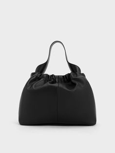 Effortlessly sophisticated and stylish, this iteration of the Ally bag will be a well-loved fixture in your wardrobe all season long and beyond. Midnight noir meets a soft and slouchy silhouette for a luxurious piece that will instantly elevate any ensemble. Ruched detailing and an elegantly curved handle create fluid lines that imbue the moody shade with a slinky femininity, best paired with the glamorous silver-toned figaro chain strap. To channel your dark feminine side, wear this Ally bag on your next date night with smokey eyes and a little black dress. Ikat Pinggang, Soft Bag, Dark Feminine, Size Chart For Kids, Smokey Eyes, Consumer Protection, Figaro Chain, Charles Keith, Bag Trends