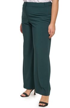 Stretch is built into sleek highline pants that are crafted with minimalistic details and double welt pockets. 32.25" inseam Zip fly with hook-and-bar closure Back double-welt pockets 63% polyester, 33% rayon, 4% spandex Dry clean Imported Model stats: 5'10" height, 41" bust, 36" waist, 48" hip. Model is wearing size 1X Modern Stretch Calvin Klein Bottoms, Modern Fitted Calvin Klein Bottoms, Calvin Klein Wide Leg Pants With Pockets, Calvin Klein Full Length Workwear Bottoms, Calvin Klein Full Length Bottoms For Workwear, Tailored Calvin Klein Bottoms With Pockets, Calvin Klein Tailored Bottoms With Pockets, Calvin Klein Full Length Pants For Workwear, Calvin Klein Workwear Pants