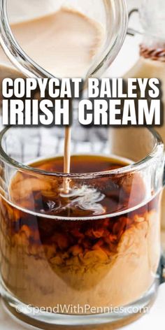 a pitcher filled with caramel and whipped cream being poured into a glass container that has the words copycat bailey's irish cream in it