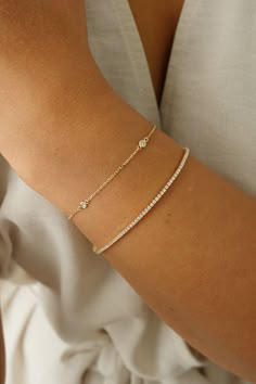 This bracelet features a bezel station design with 4 dazzling round diamonds. Minimalist Accessories Jewellery, Distance Bracelet, Jewellery Dainty, Bracelets Stacked, Gold Bracelets Stacked, Distance Bracelets, Andromeda Galaxy, Minimalist Accessories, Pretty Accessories