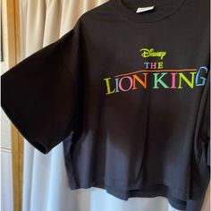 Disney The Lion King X Asos Design Unisex Oversized Cropped T-Shirt With Rainbow Logo. Never Worn. Quite A Thick Material - Feels Good Quality Black Graphic Print Tops For Disney Fan Events, Oversized Black Character Print Tops, Oversized Black Tops With Character Print, Black Tops With Character Print In Oversized Fit, Disney Letter Print Tops For Streetwear, Black Disney Short Sleeve Tops, Disney Letter Print T-shirt For Streetwear, Disney Streetwear T-shirt With Letter Print, Disney Streetwear Black Top