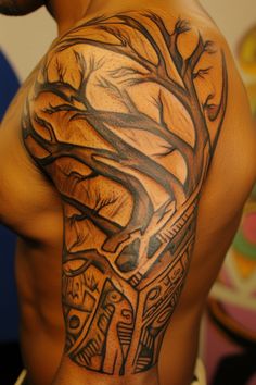 A detailed tree tattoo covering a person's shoulder and upper arm. Cool African Tattoos, West African Tattoo Ideas, African Spirituality Tattoo Ideas, African Arm Tattoo, African Theme Sleeve Tattoo, Indigenous Artwork