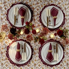 the table is set with place settings for four people to enjoy their meal or dinner