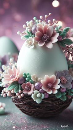 an egg decorated with flowers in a nest on a purple tablecloth and glitters