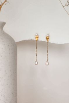 The Aimee Pearl Earrings are meticulously handcrafted using freshwater drop pearls paired with 14k gold-filled components, holding a unique and playful appeal.  Packaged in an elegant plastic-free reusable jewelry box, they make the perfect gift or special treat for oneself. *14k Gold-filled components *Freshwater drop pearls *Hypoallergenic, suitable for even the most sensitive skin *Delivered in a 100% silk jewelry pouchette inside a gift box *Sustainable magnetic closure jewelry box and custo Gold Teardrop Pearl Earrings For Gift, Gold Teardrop Pearl Earrings As A Gift, Elegant Long Drop Pearl Earrings As Gift, Elegant Long Drop Pearl Earrings For Gift, Gold Plated Dangle Pearl Earrings As Gift, Gold Pearl Drop Earrings As Gift, Gold Plated Teardrop Pearl Earrings For Gift, Gold Pearl Drop Earrings For Gift, Long Drop Pearl Earrings For Gift