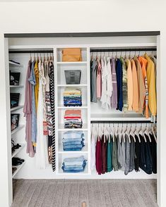 an organized closet with clothes and shoes