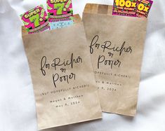 two brown paper bags with writing on them