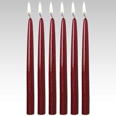 five red candles are lined up in a row