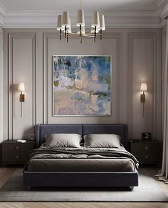 a large bed sitting in a bedroom next to two lamps and a painting on the wall