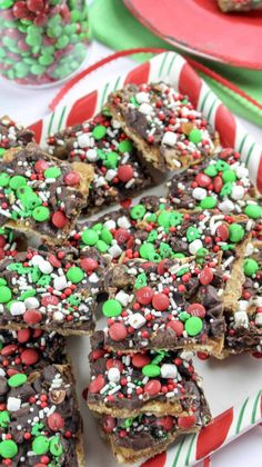 christmas brownies with candy and sprinkles on a plate