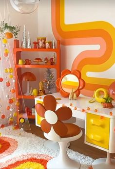 an orange and white room with a flower on the desk in front of a colorful wall