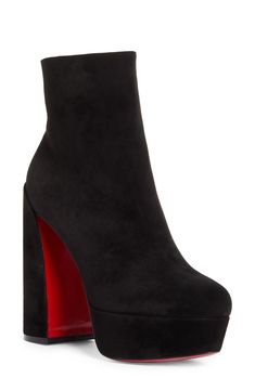 Pre-order this style today! Add to Shopping Bag to view approximate ship date. You'll be charged only when your item ships.A chunkier-than-most platform and lofty sculptural heel provide statement-making lift for this sleek ankle boot crafted of supple calfskin suede. Christian Louboutin's iconic red sole—born from a fateful brush with nail lacquer—adds a burst of signature color to every step. 5" (127mm) heel; 1 1/2" platform (size 38.5) 5" shaft Side zip closure Wipe with a soft, dry cloth and Christian Louboutin Platform Heels, Christian Louboutin Bag, Louboutin Boots, Louboutin Bags, Christian Louboutin Boots, Black High Heel Boots, Christian Louboutin Women, Leather Western Boots, Louboutin Heels