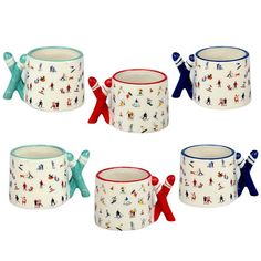 four mugs with people on them are shown in different colors and designs, one is blue, the other has red