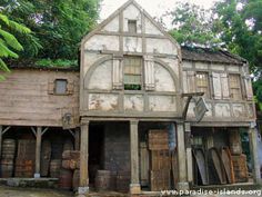 an old wooden building with lots of windows