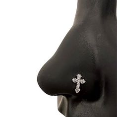 the nose has a cross on it and is attached to a black plastic mannequin