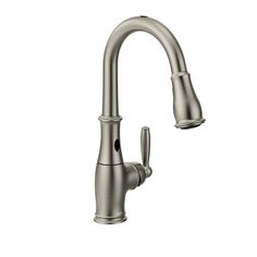 a kitchen faucet with the pull out sprayer and chrome finish, on a white