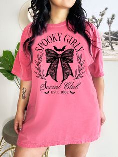 Be on trend this Halloween with this cute and unique Spooky Girly Social Club Shirt! This Halloween Comfort Colors® Dark Coquette Bow Tshirt is sure to be a hit at the Halloween Party or to surprise the Trick or Treaters! Super comfy! Size up for a Trendy Oversized Look! SHIPS FREE! SIZING TIPS: Size up 2-3 sizes from your "usual size" to get the "Oversized" Look! (2 sizes up is most common, and 3 sizes up is more dramatic) For a "relaxed fit" order your "usual size". When in doubt, lay your fav Trick Or Treaters, Dark Coquette, Comfort Colors Tshirt, Bow Shirts, Coquette Bow, Club Shirts, Trick Or Treater, Lace Bows, Social Club