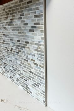 small mosaic tile backsplash in kitchen showing end of run capped off with schluter jolly strip. Jeffrey Court, Village Home, Custom Benches, Quad Cities, Shower Niche, Great Wall, At Home Store, Tile Backsplash, Wall Tile