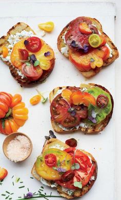 several slices of bread with tomatoes and other toppings