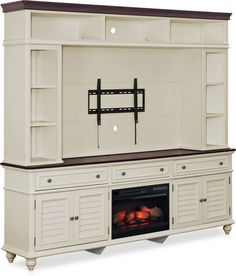 an entertainment center with a fire place in it