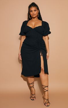 Your new season wardrobe never looked so good with this plus size black dress girl. Featuring a black material with a ruched side split design and puff sleeves. Just add tie-up heels and your fave accessories for a look that is perfect for your weekend plans.   Length approx 132cm/52 (Based on a sample size UK 16)   Model wears size UK 16/ EU 44/ AUS 16/ US 12 Plus Size Black Dresses, Girls Black Dress, Puff Sleeve Midi Dress, Look Plus Size, Midi Dress Plus Size, Draped Midi Dresses, Outfit Chic, Weekend Plans, Moda Plus