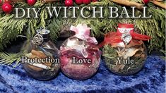 three glass vases filled with different types of christmas decorations and words diy witch ball protection love yule