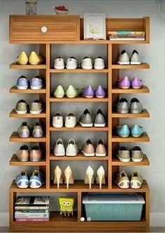 there are many pairs of shoes on the shelves