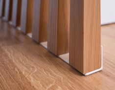 a close up view of a wooden floor with white trim on the bottom and sides