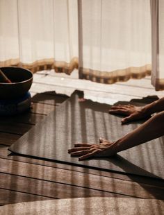 two people are doing yoga on the floor