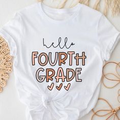 PLEASE READ ENTIRE DESCRIPTION BEFORE ORDERING Unisex Fit Fourth Grade Shirt, 4th Grade Shirt, 4th Grade Team, Cute 4th grade tee, Hello 4th grade, Back to school shirts, First Day Fall in love with this soft and cozy Graphic Tee, Sweatshirt or hoodie  TO MAKE YOUR SHOPPING EXPERIENCE EASIER, YOU CAN "CHOOSE" A T SHIRT, SWEATSHIRT OR HOODIE IN THIS LISTING. Size up 1-2 sizes for a slouchy oversized fit PINK, Sand and light blue are NOT available in a 4X 5X Sweatshirt but they ARE  available in T White Slogan Shirt For School, White Slogan Tops For Back To School, First Day Fall, 4th Grade Shirt, Back To School Shirts, Back To School Fits, Funny Sweaters, Family Funny, Girl's Back