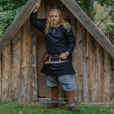 Great looking, comfortable Viking Age tunic made from dense, durable wool. Based on historical sources Color: Black Historically accurate gores on the sides Material: 100% felted wool (350 gsm) Handwash only Sizes: S - 3XL Accessories not included All accessories available in the Grimfrost webshop. Machine sewn. The stitching can be easily hidden with woven bands along the neckline, hem and sleeves for a hand-sewn appearence. MOTHER EARTH The tunic is made from recycled wool that is a great ECO- Pagan Clothing Modern, Authentic Viking Clothing, Viking Style Long Sleeve Outerwear For Larp, Viking Style Tunic For Larp, Black Long Sleeve Medieval Dress, Viking Style Long Sleeve Medieval Dress For Festivals, Long Sleeve Medieval Dress For Larp, Viking Style Tunic Medieval Dress For Larp, Viking Tunic Medieval Dress For Larp