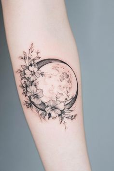 Floral tattoo with a crescent moon on forearm. Full Moon Tattoos For Women, Wildflower Moon Tattoo, Birth Moon Tattoo, Creative Moon Tattoo, Crescent Moon Tattoo With Flowers, Planet Tattoos For Women, Shaded Moon Tattoo, Moon Tatoos Woman, Flower Moon Tattoo Designs