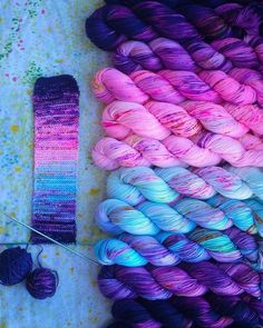 several skeins of yarn and two skeins of yarn next to each other