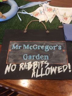 a sign that says mr mcgreor's garden no rabbits allowed on the grass