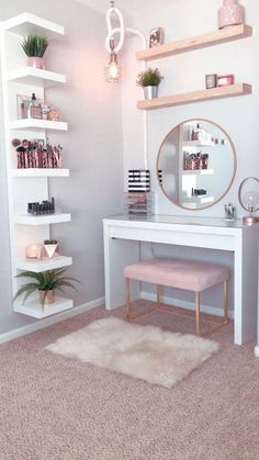 a white desk with shelves and a mirror on it in front of a pink rug