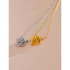 Add a touch of romance with our Gold Rose Pendant Necklace. This delicate floral charm necklace is perfect for elegant and everyday wear. Shop now at Tomoko Store for timeless beauty Finish: 18K Gold plated Waterproof: does not change color from water exposure Lead and nickel free Material: Stainless steel(waterproof!) Size: 42x5cm Weight: 5g All our jewelry are made of stainless steel material. For the gold pieces, we added an 18K PVD gold plating. This means the colour will last for a really l Elegant Rose Gold Charm Necklaces For Mother's Day, Elegant Rose Gold Flower Charm Necklaces, Feminine Rose Gold Jewelry With Rose Design, Dainty Rose Design Flower-shaped Necklace, Elegant Rose Gold Flower Charm Necklace, Elegant Rose Gold Charm Necklace For Her, Delicate Rose Gold Flower Necklace With Clavicle Chain, Elegant Rose Gold Charm Necklace As Gift For Her, Dainty Rose Gold Necklace With Rose Design