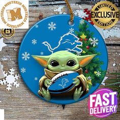 a christmas ornament with an image of baby yoda holding a football ball