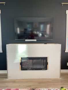 a flat screen tv mounted to the side of a fireplace