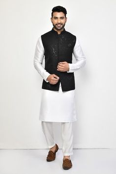 Black bundi with all over sequin embellishments in geometric pattern. Paired with an inner white kurta with pant. - Aza Fashions Festive Long Sleeve Nehru Jacket With Sequins, Traditional Fitted Nehru Jacket With Sequins, Fitted Nehru Jacket With Sequins For Eid, Fitted Sequin Nehru Jacket For Eid, Traditional Nehru Jacket With Sequins For Eid, Collar Kurta, Kurta Set Men, White Kurta, Nehru Jacket