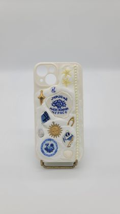 a cell phone case with various items on it