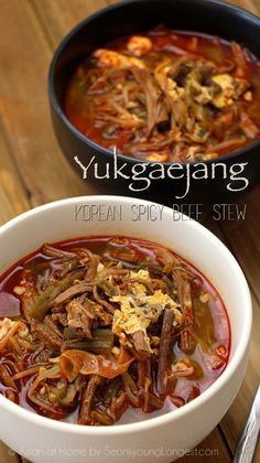 two bowls filled with beef and vegetable soup