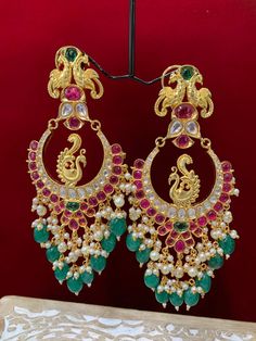 Premium quality High gold plated, pearl work, hand carved work , AD lining and kundan work. Clip back.  about 5.5 inch long  Absolute designer piece and statement earring. Luxury Green Chandbali Earrings, Luxury Kundan Danglers For Ceremonial Occasions, Luxury Ornate Chandbali Bridal Earrings, Luxury Kundan Chandbali Chandelier Earrings, Luxury Fusion Chandbali Danglers, Luxury Cutdana Chandbalis For Festive Occasions, Luxury Green Chandbali Jhumkas, Luxury Green Chandbalis With Tilla Detail, Luxury Multi-stone Chandbali Earrings