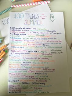 a list of things to do in the summer on top of a table with crayons and pencils