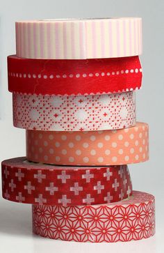 several rolls of washi tape stacked on top of each other